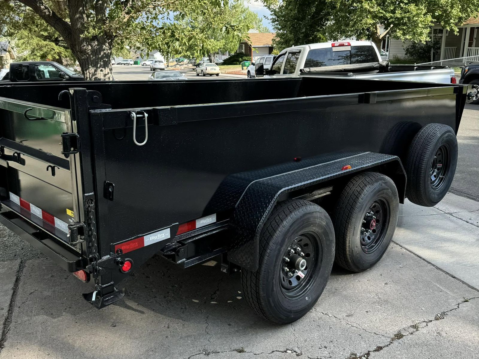 14-foot dump trailer rental parked curbside in Delaware, Delaware