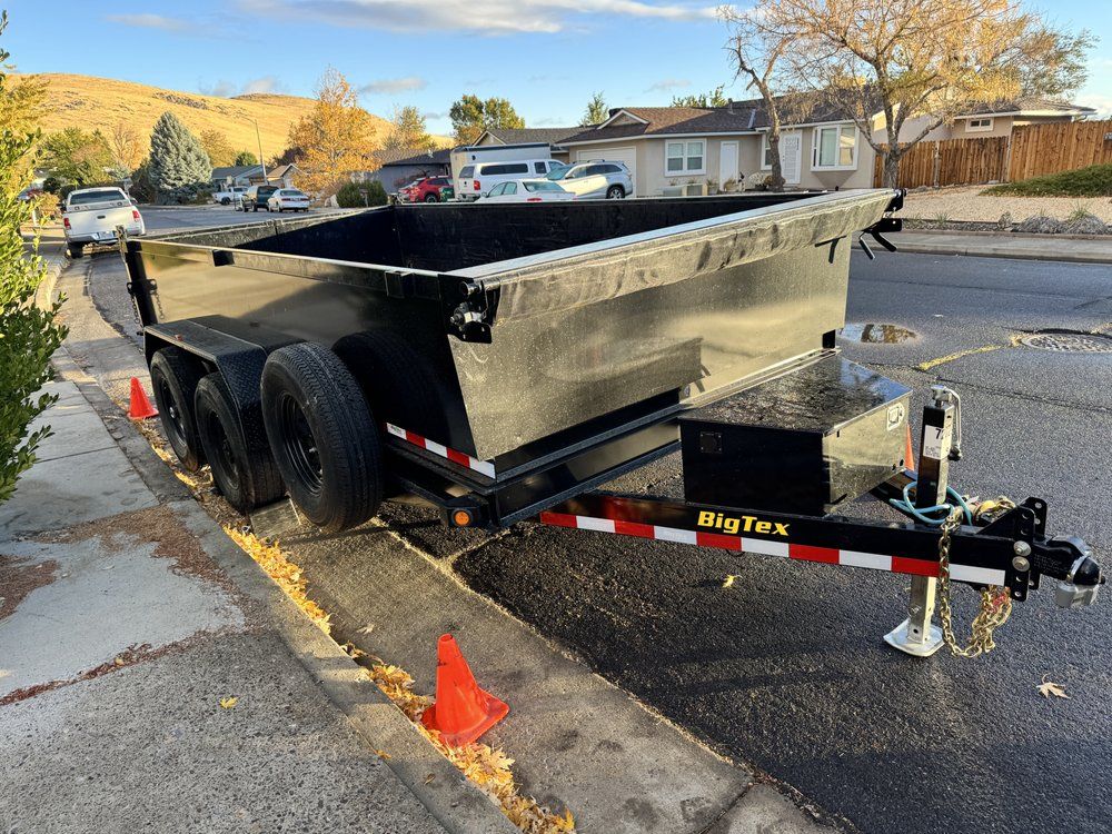 Dump trailer rental set up on a residential street in Brookside, DE