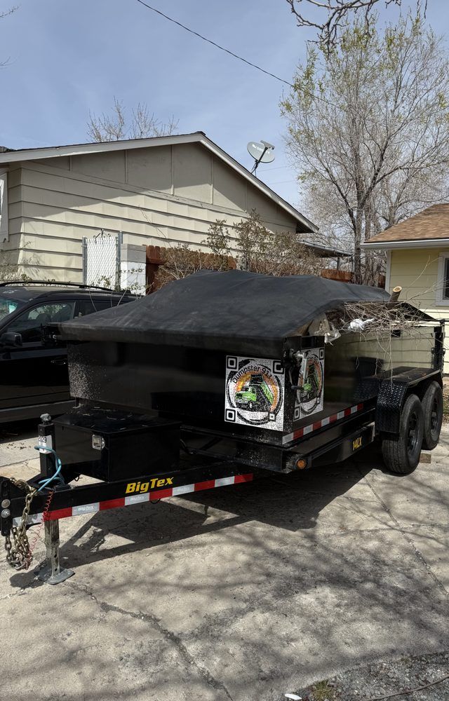 Tarped dump trailer loaded with yard waste in Bear, Delaware